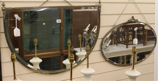 A bevelled mirror in decorative brass frame and another mirror, W.77cm and 69cm